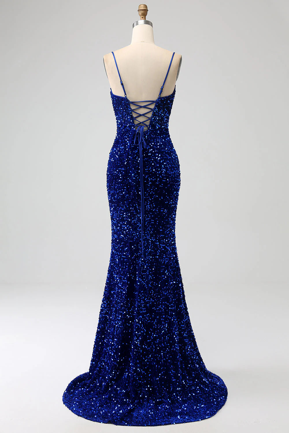 Side view of the royal blue velvet sequin mermaid dress.