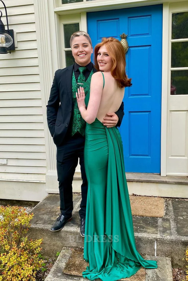 Full-length view of a green mermaid formal gown with spaghetti straps.