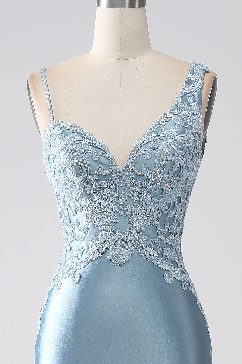 Close-up of the bodice on the grey-blue mermaid prom dress, showing delicate beading and appliques.