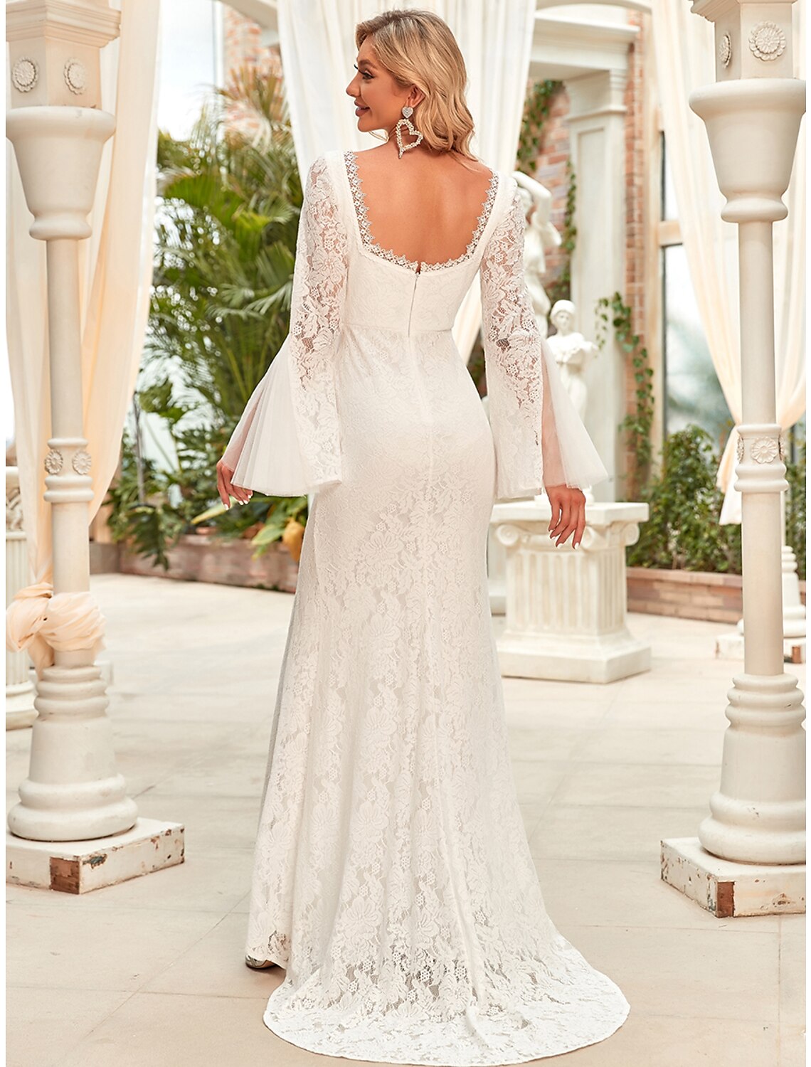 Back view of the reception wedding dress, highlighting the graceful train.