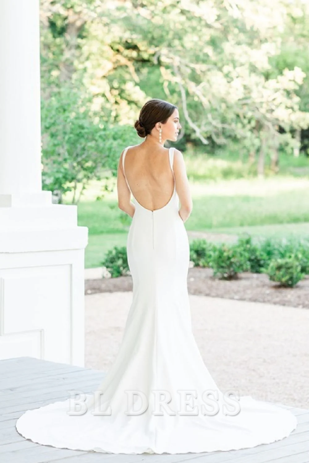 Back view of the elegant white mermaid wedding gown.