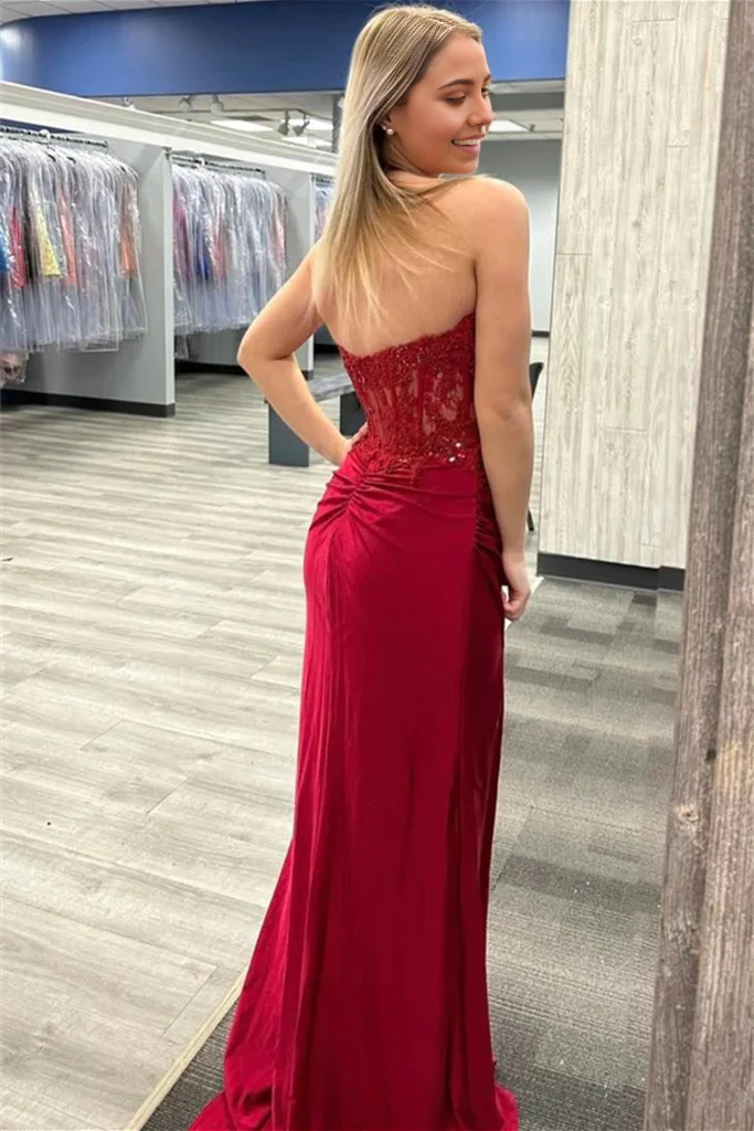 Side view of a mermaid prom dress, showcasing the slit and flowing skirt.