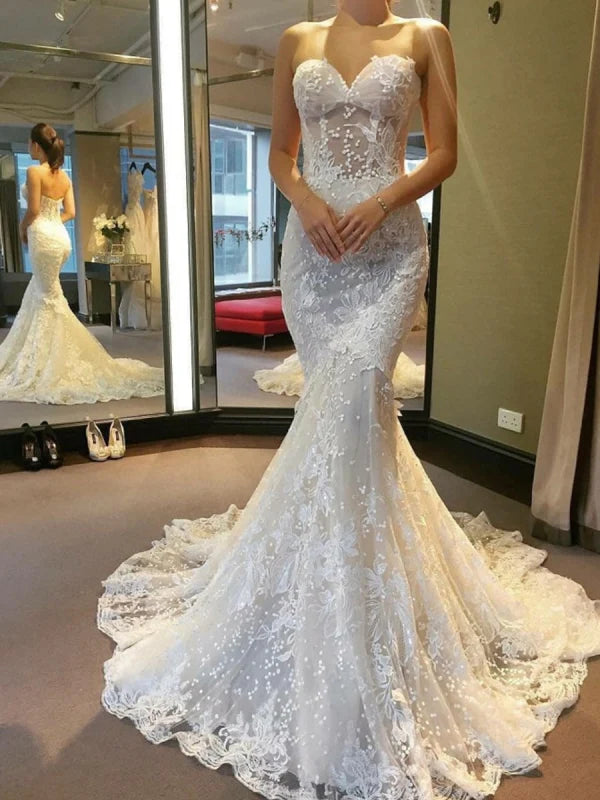 Elegant mermaid strapless backless lace wedding dress.