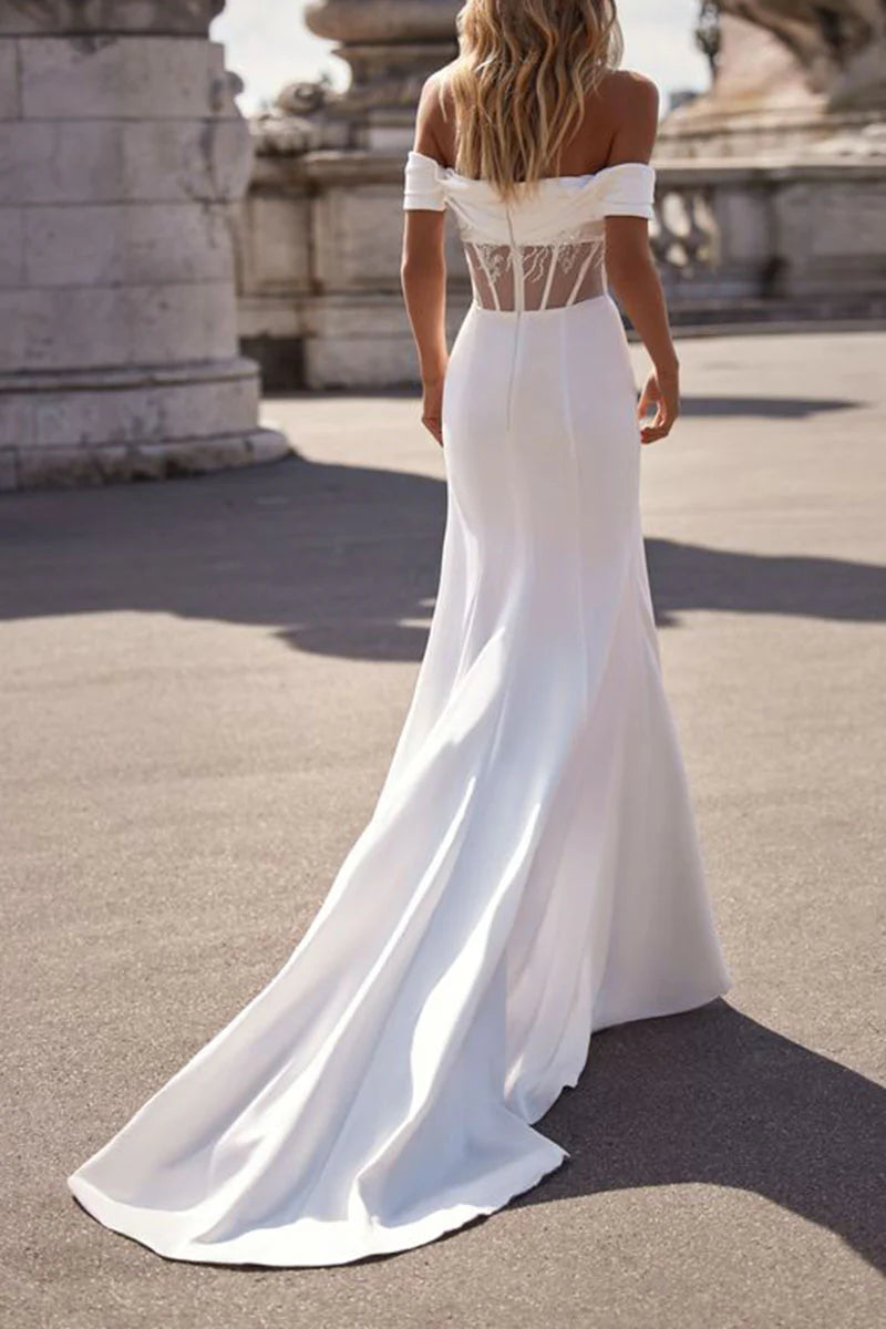 Side view of the strapless mermaid wedding dress, highlighting the satin fabric and silhouette.