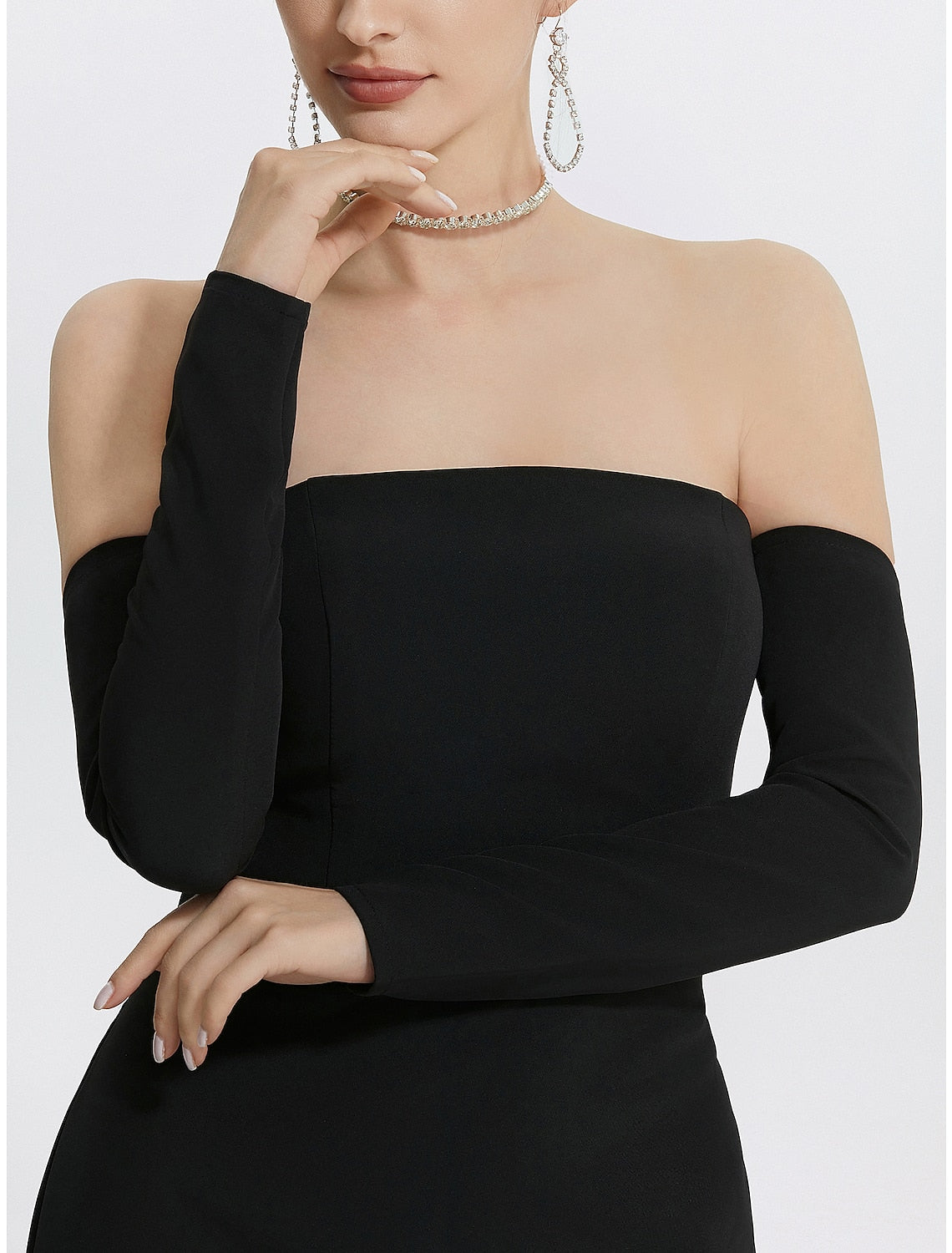Close-up of the black strapless mermaid gown, highlighting the stretch fabric.