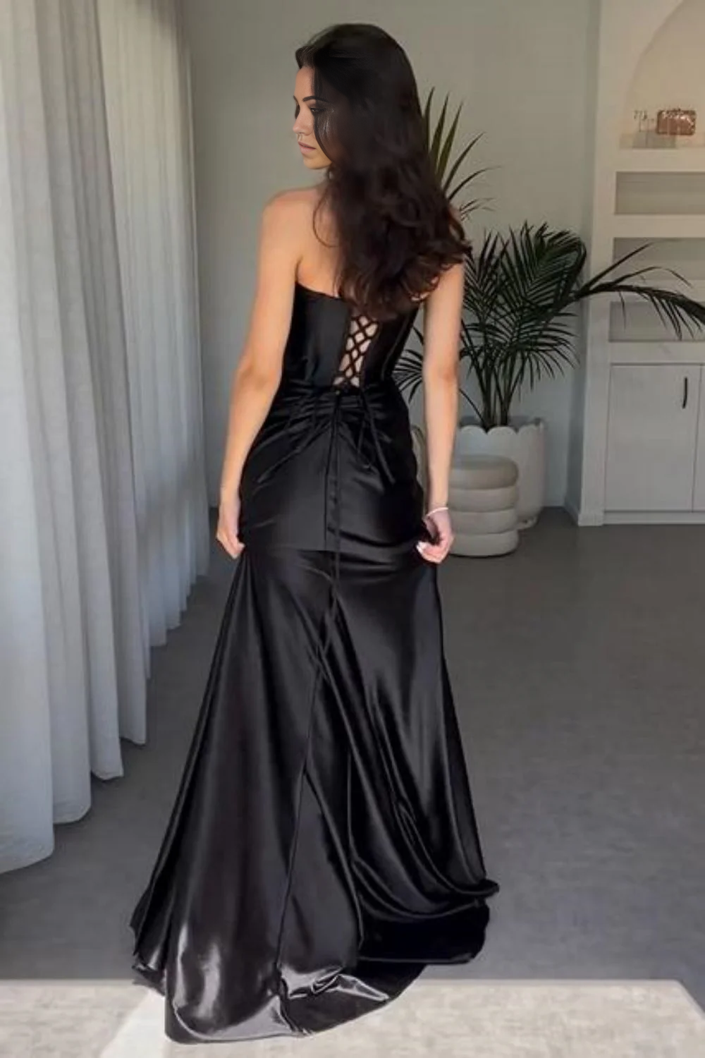 Back view of the mermaid satin dress, showcasing the intricate lace-up detail.