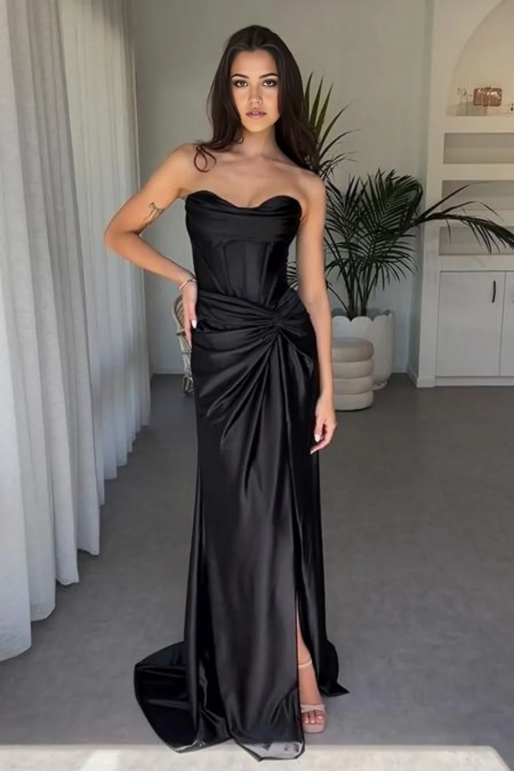 Close-up of the luxurious satin fabric and the stylish split on the mermaid dress.