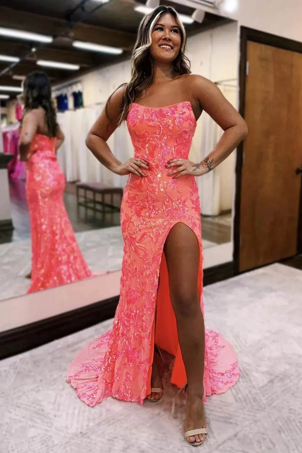 Mermaid strapless prom dress with lace-up back and high slit.