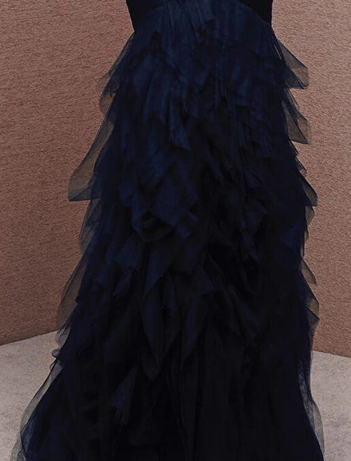 Close-up of the ruched tulle detail on the strapless gown.
