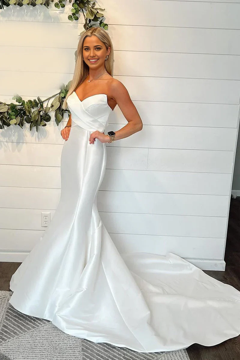 Elegant mermaid strapless satin wedding gown, full length view.