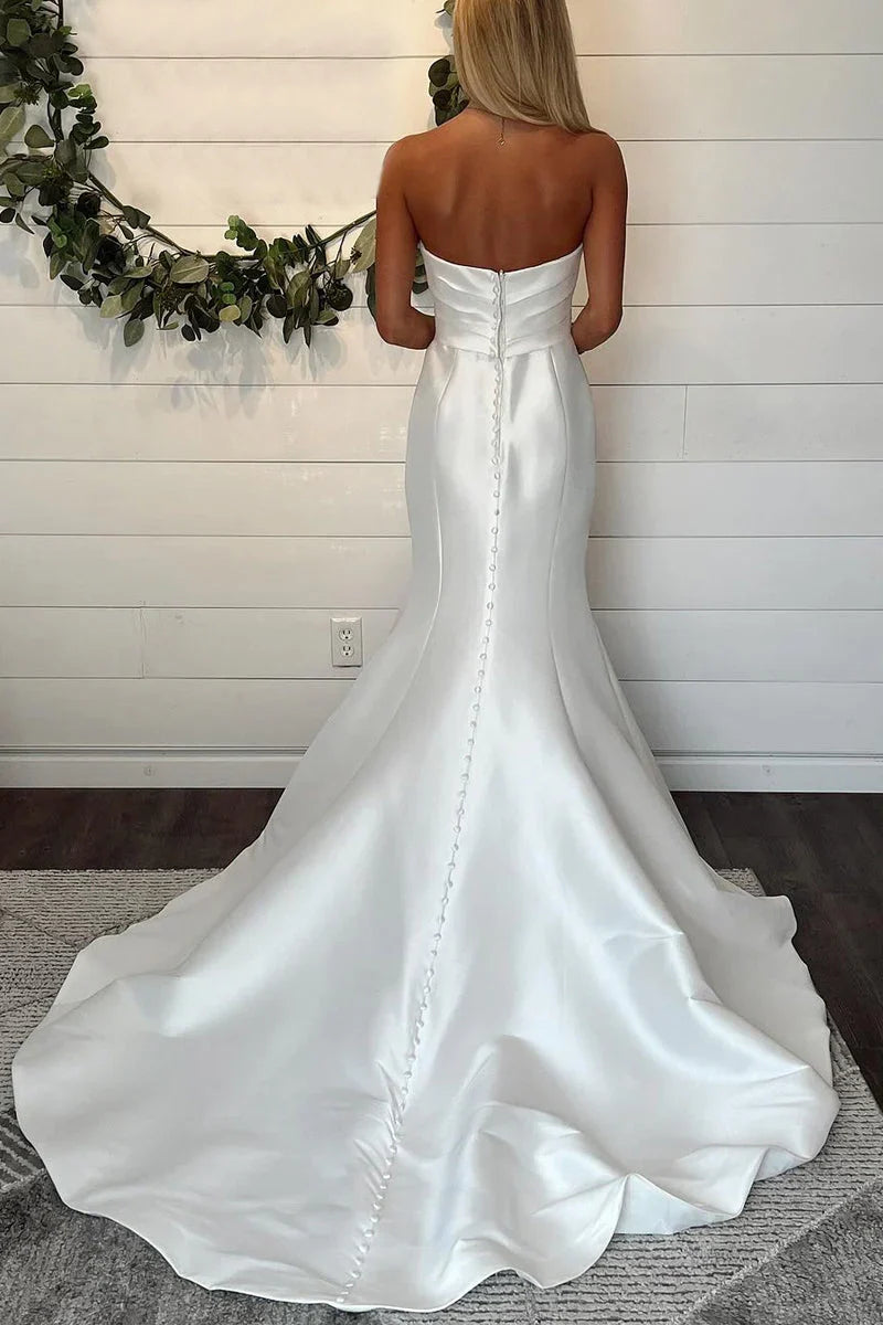 Mermaid strapless satin bridal gown, side view.