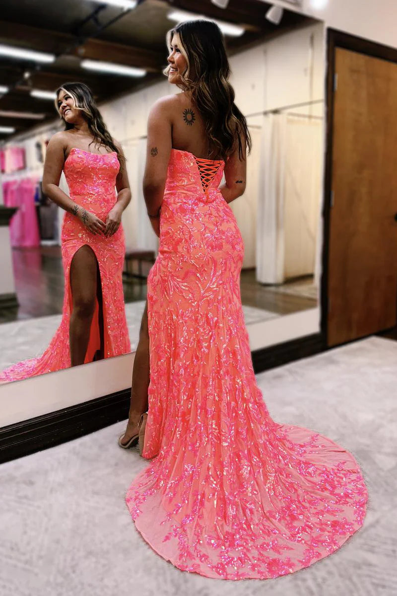 Side view of the fuchsia sequin mermaid prom dress, highlighting the silhouette and slit.