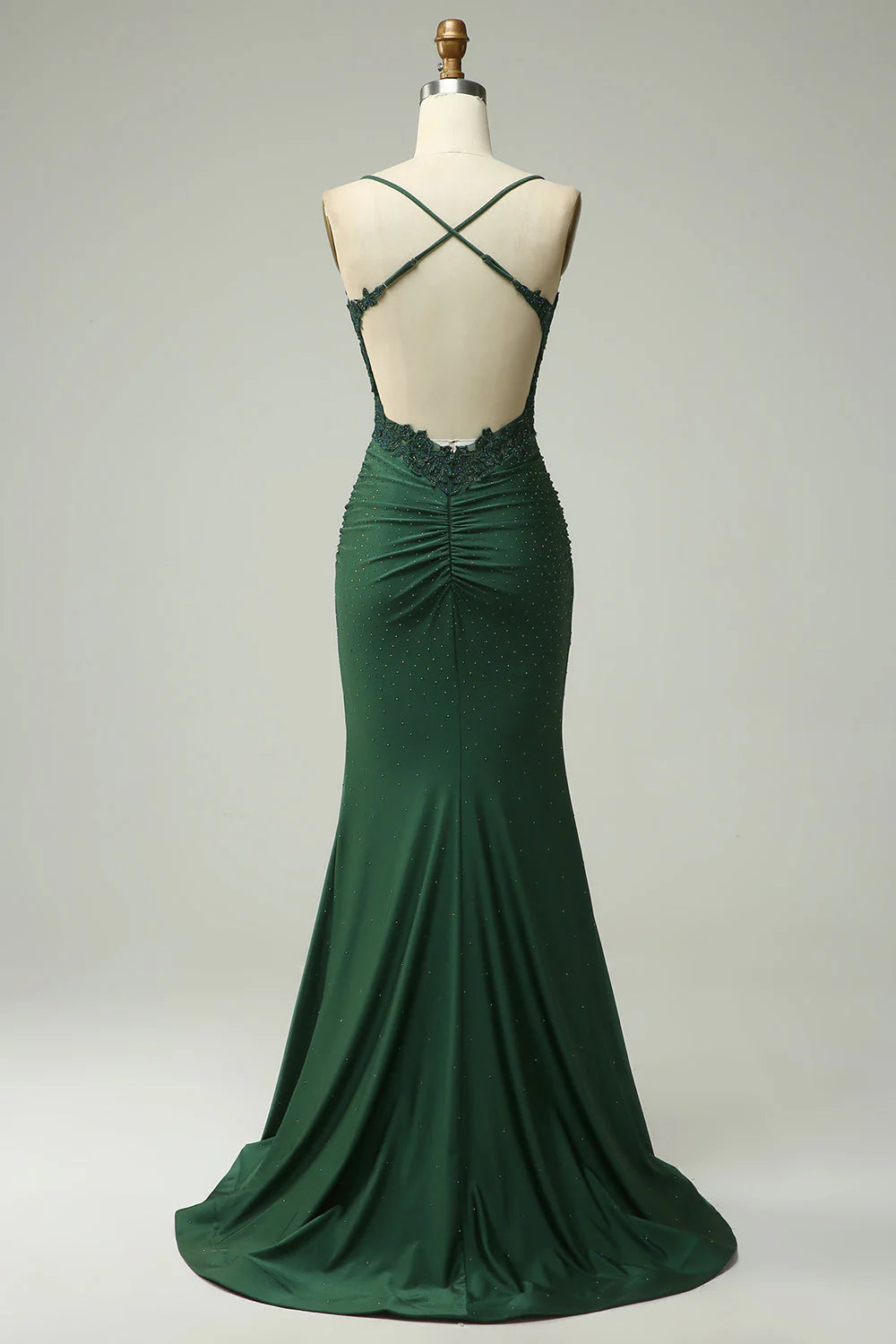 Side profile of a woman wearing the navy blue mermaid prom dress, showcasing the silhouette.