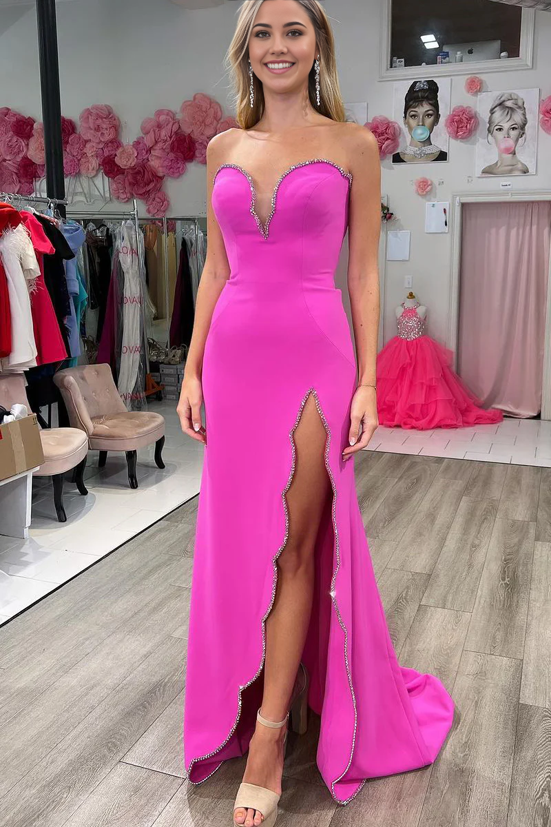 Elegant pink mermaid prom dress with sweetheart neckline and intricate beading.