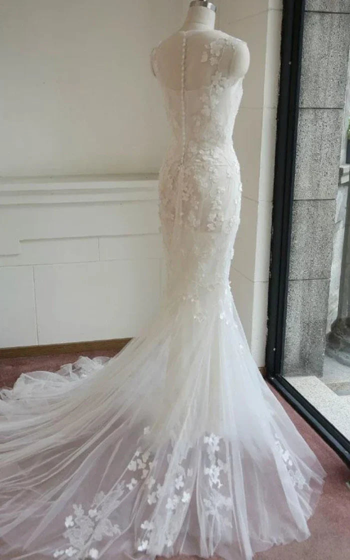 Back view of mermaid wedding dress showing lace detailing.