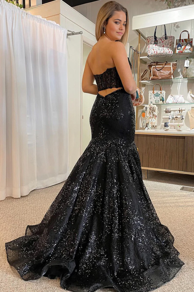 Full view of the black sequin lace mermaid prom dress with long sleeves.