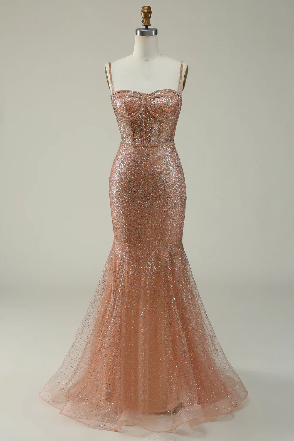 Blush pink mermaid prom dress with sweetheart neckline and spaghetti straps.