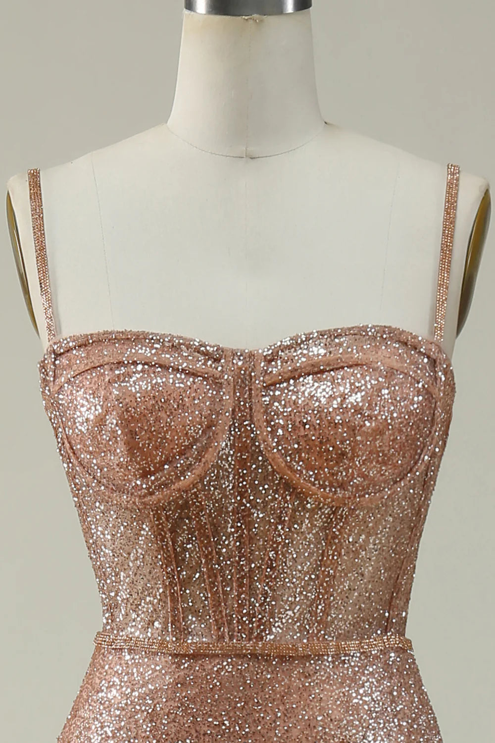 Side profile of a blush pink formal mermaid gown.