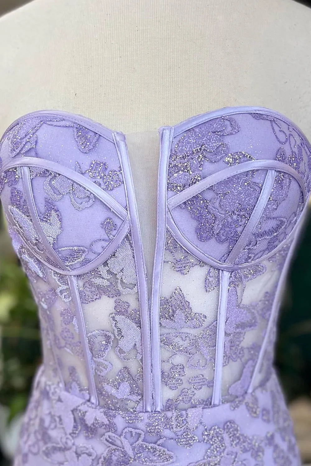 Side view of the mermaid prom dress, highlighting its silhouette and delicate embroidery.