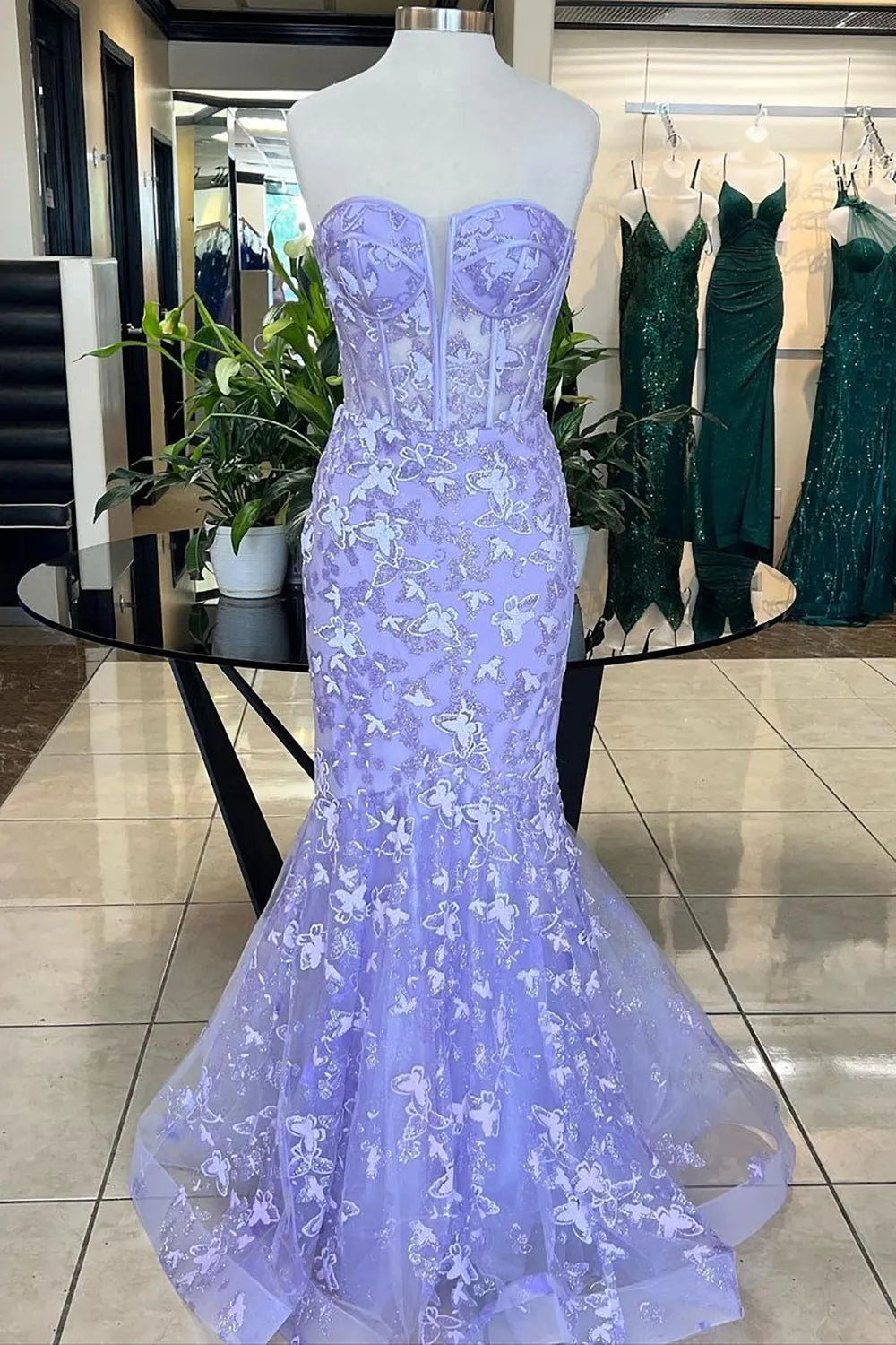 Back view of the embroidered mermaid prom dress, showcasing the corset detailing.