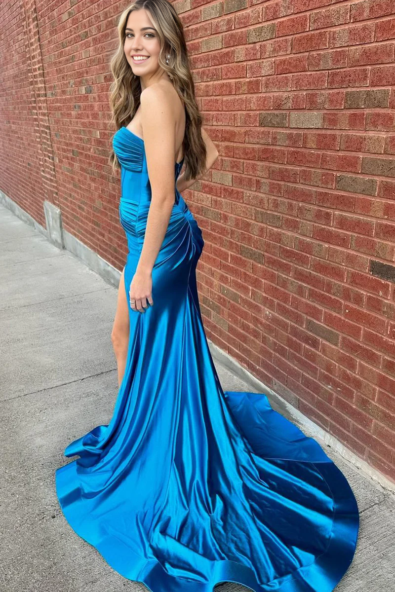 Back view of a mermaid satin prom dress with a flowing silhouette.