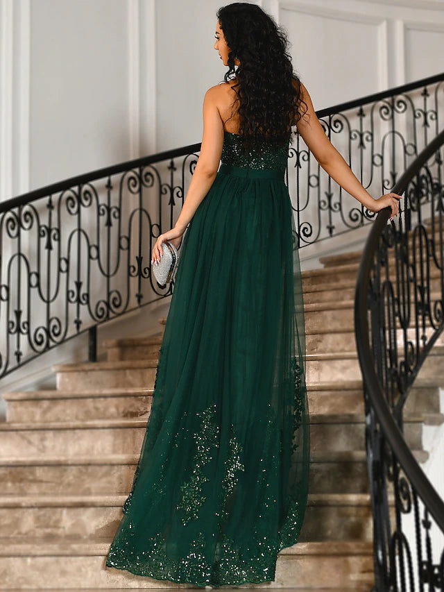 Back view of the mermaid evening gown showing floor-length design.