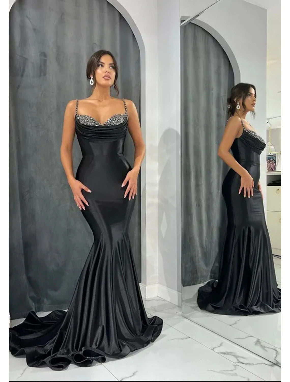 Elegant mermaid sweetheart evening gown with glitter crystals and open back.