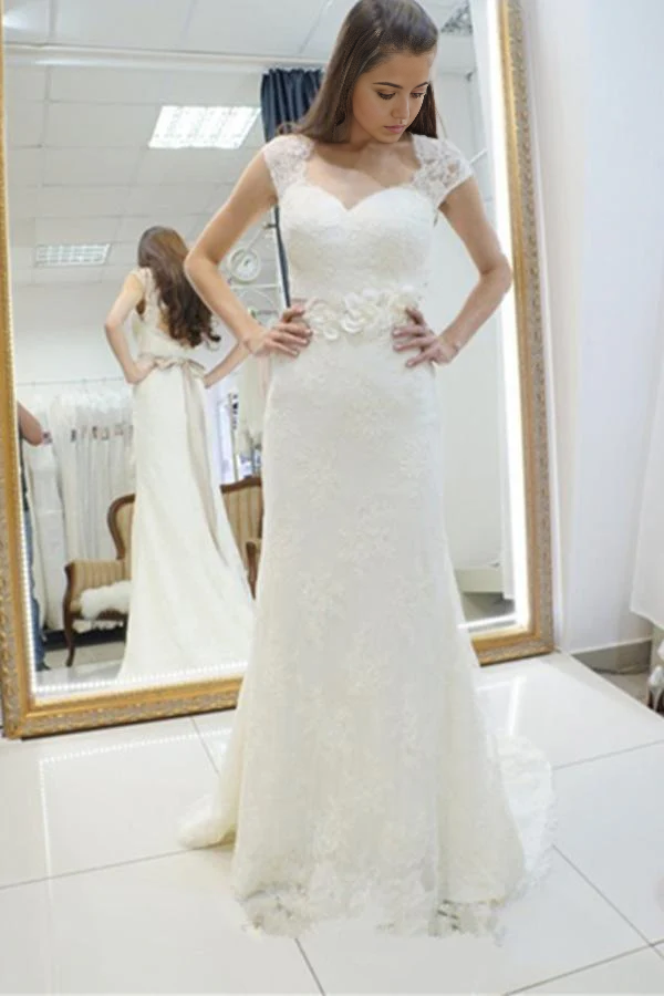 Elegant mermaid wedding dress with sweetheart neckline and lace appliques.