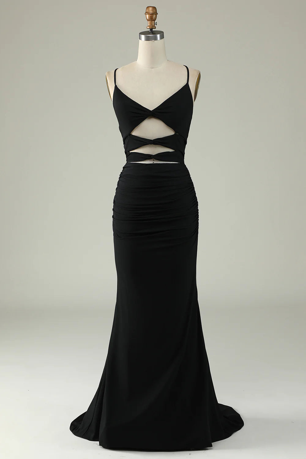 Woman wearing an elegant black mermaid prom dress with a lace back, posing frontally.