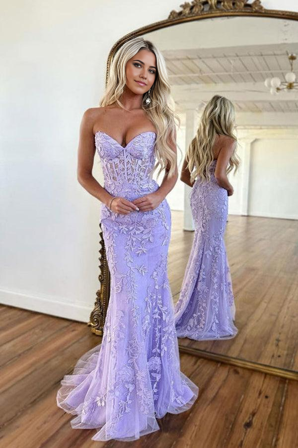 Purple mermaid prom dress with sweetheart neckline and lace details.
