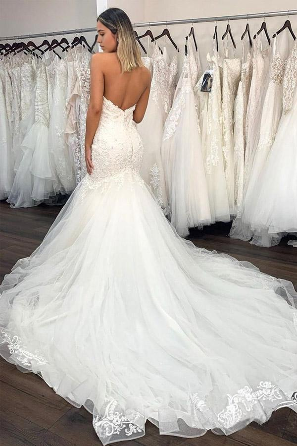 Back view of mermaid wedding dress with lace detailing.