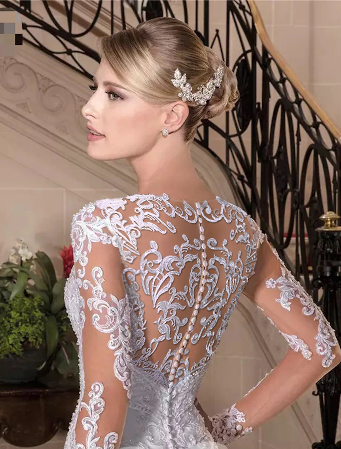 Back view of a mermaid wedding dress showing the court train and lace details.
