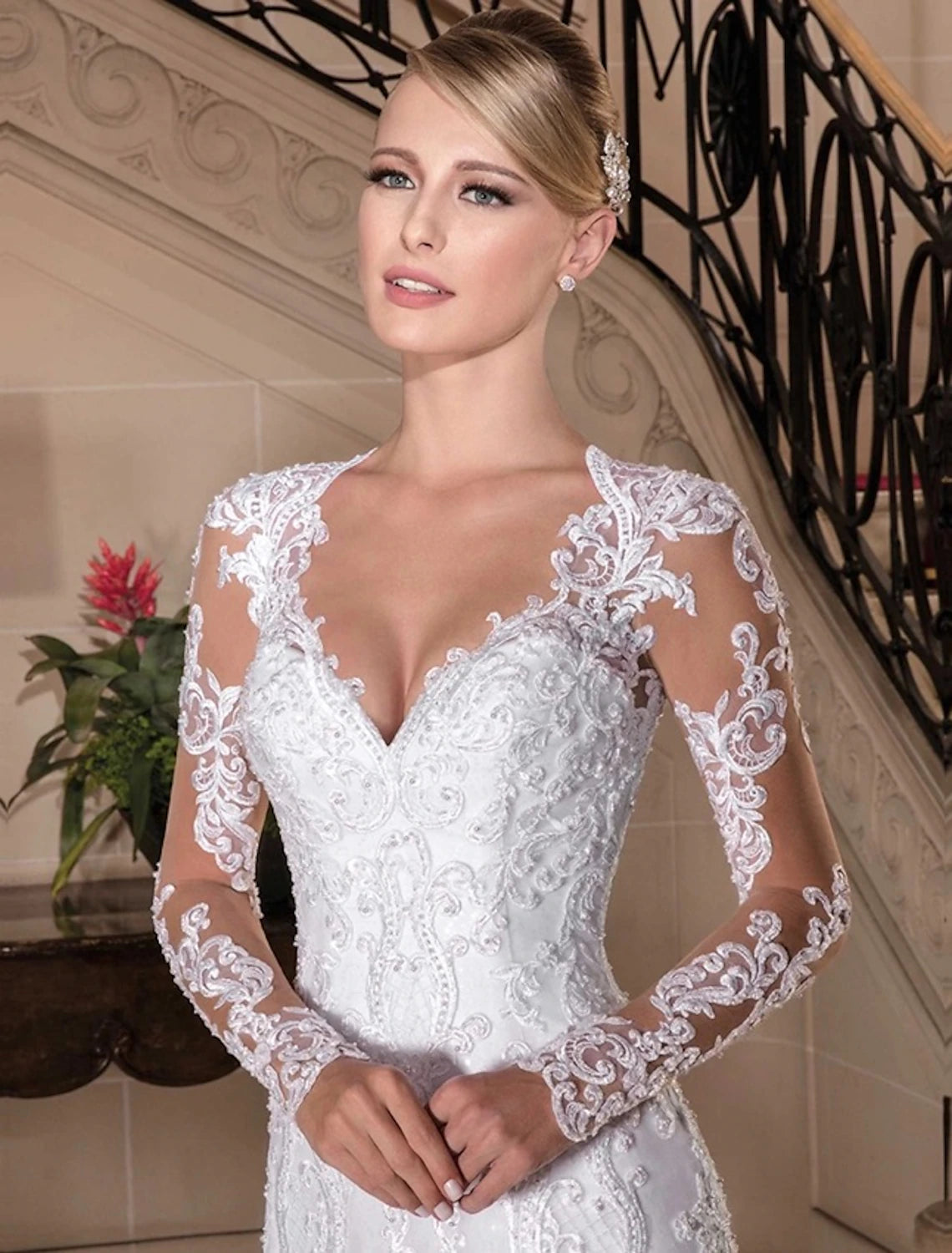 Side profile of a bride wearing a trumpet silhouette wedding gown.