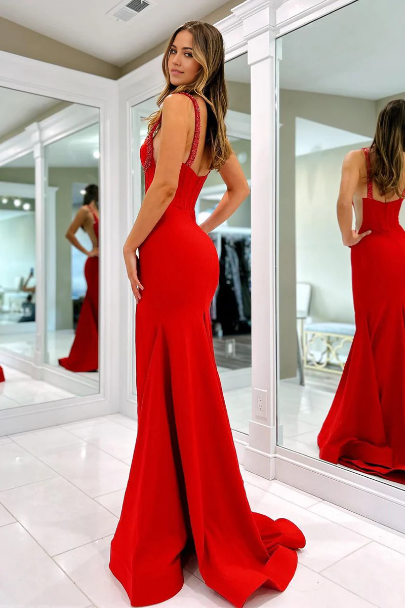 Close-up of the sweetheart neckline and delicate beading on the navy satin prom dress.