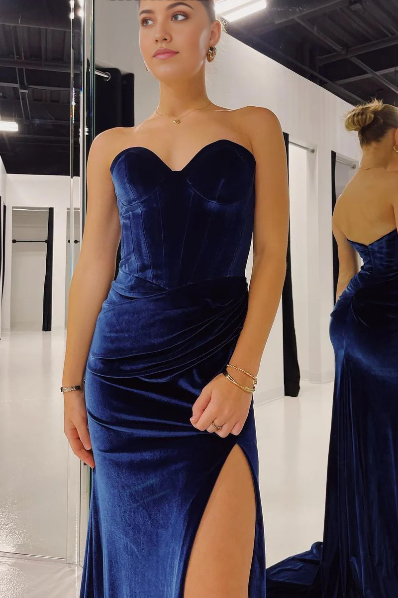 Back view of a navy velvet mermaid prom dress, showcasing the elegant design and flowing train.
