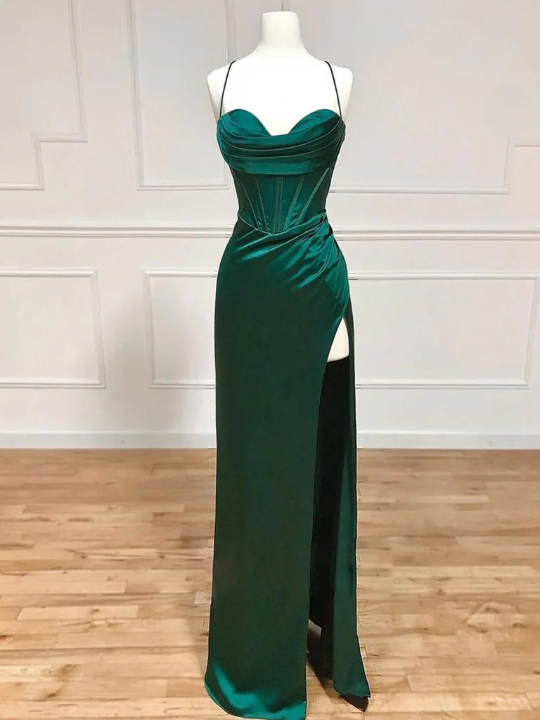 Woman wearing an elegant mermaid sweetheart neck long prom dress.