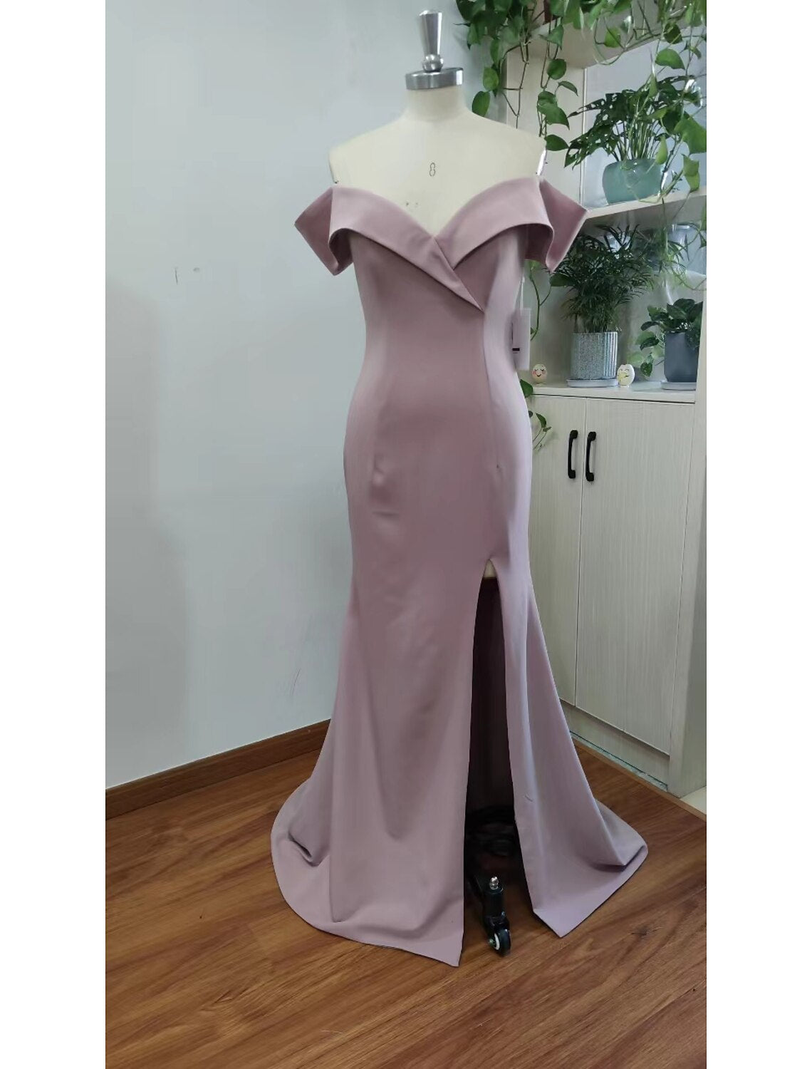 Elegant mermaid evening gown with sweetheart neckline and short sleeves.