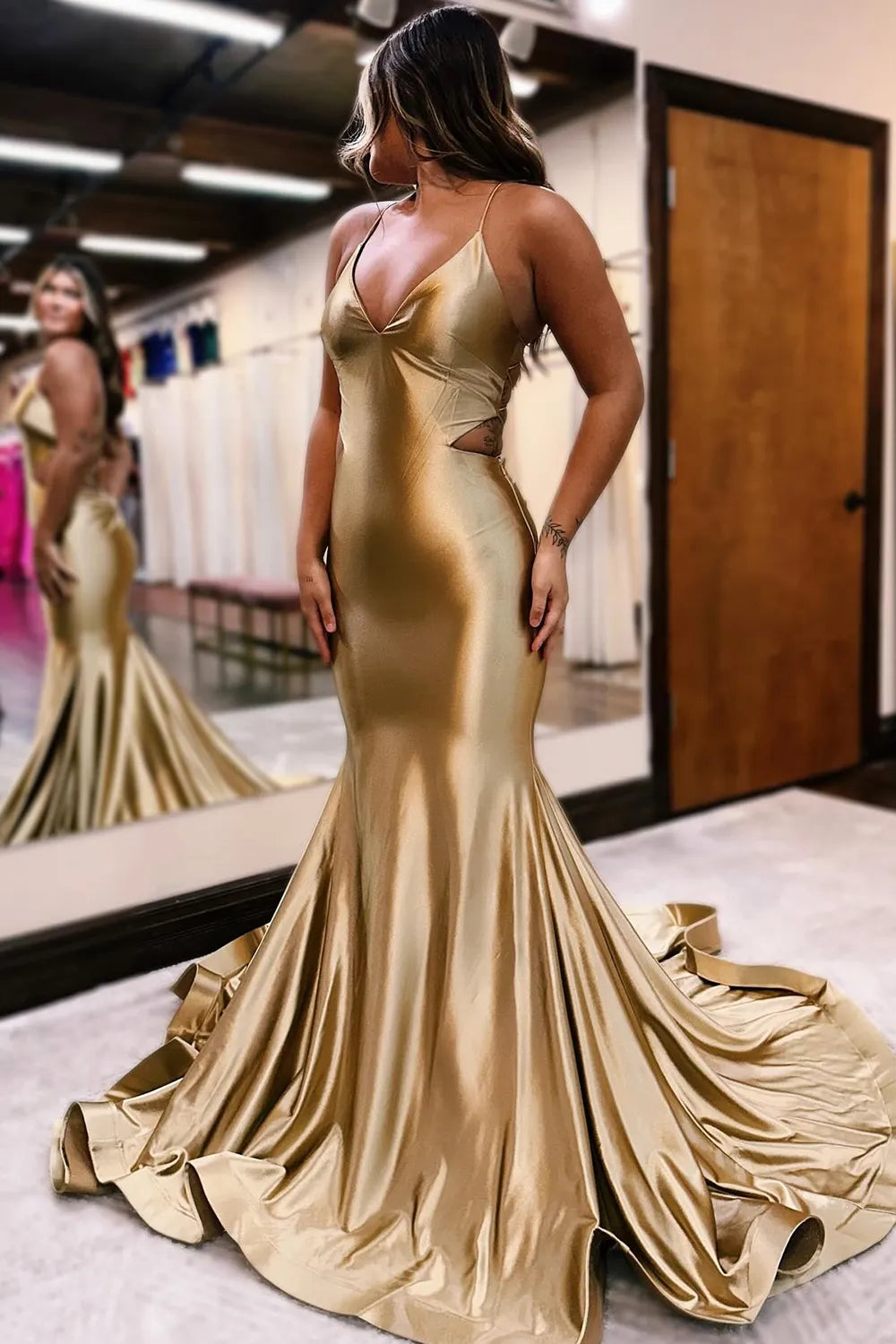 Elegant mermaid prom dress with spaghetti straps and lace-up back.