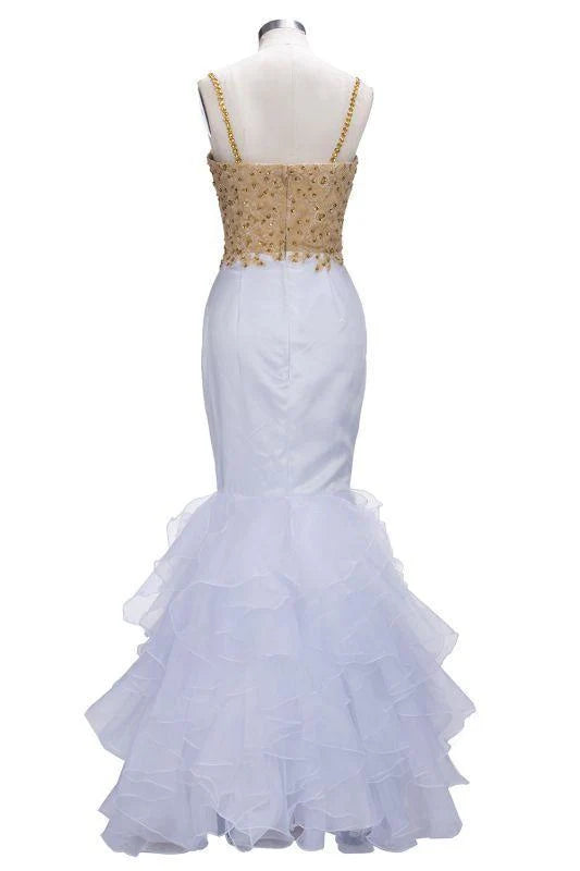 Long tulle prom gown featuring a mermaid silhouette and sparkling details.