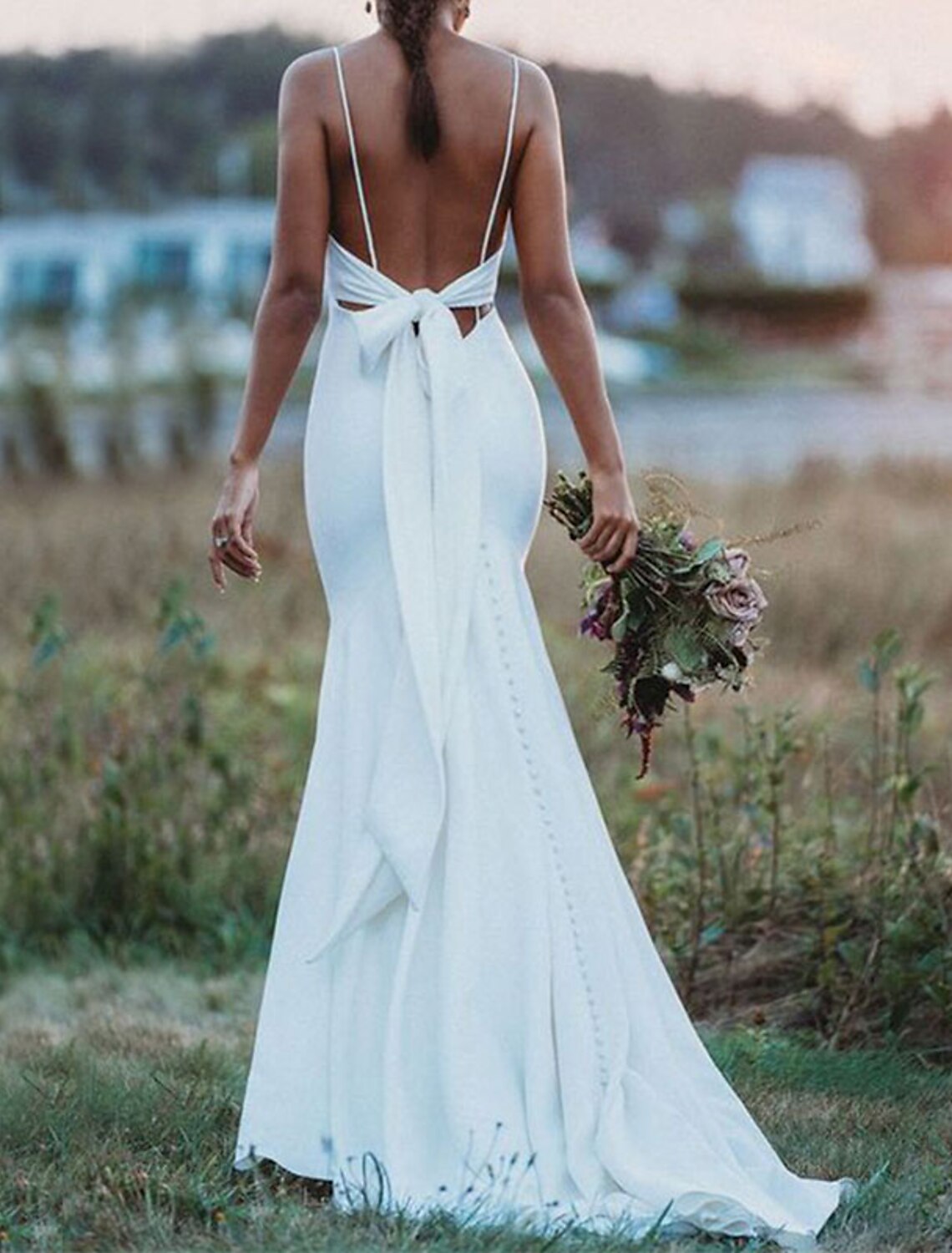 Full length view of the elegant satin wedding dress, perfect for a bride.