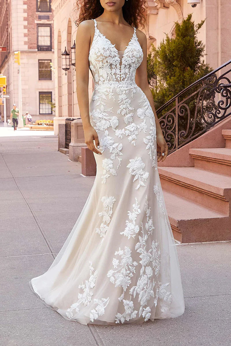 Elegant mermaid wedding dress with lace appliques and court train.