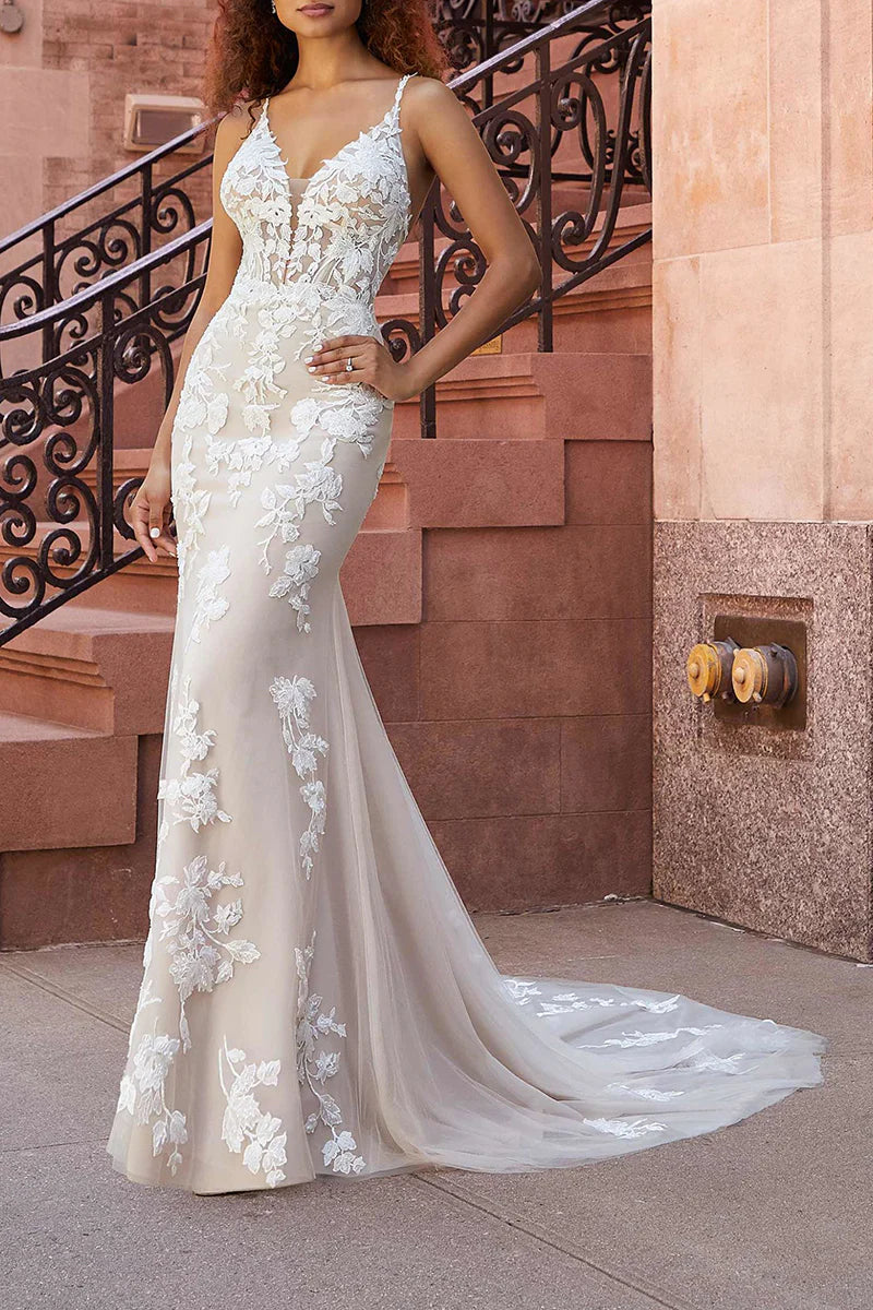 Close-up of delicate lace appliques on the wedding dress bodice.