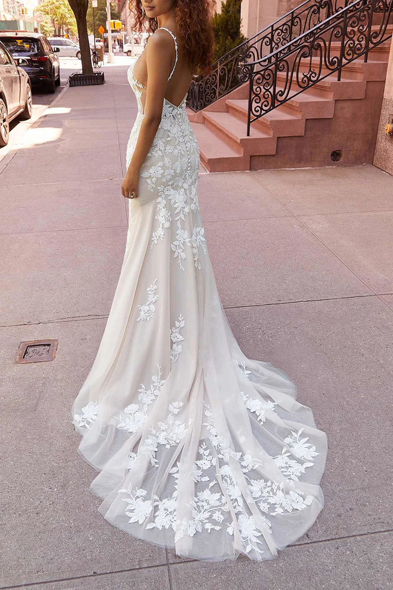 Side profile of a bride wearing the mermaid wedding dress.