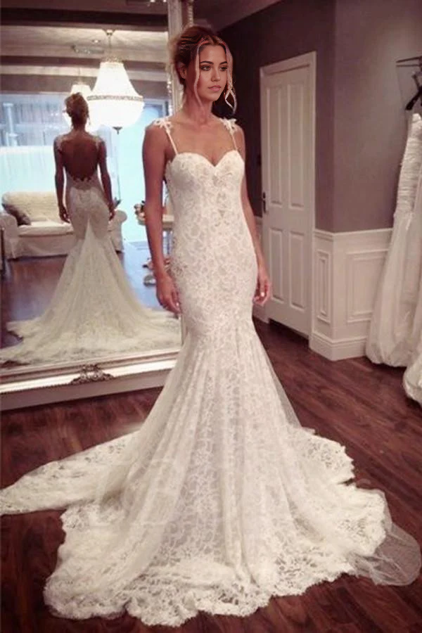 Elegant mermaid wedding dress with sweetheart neckline and lace details.