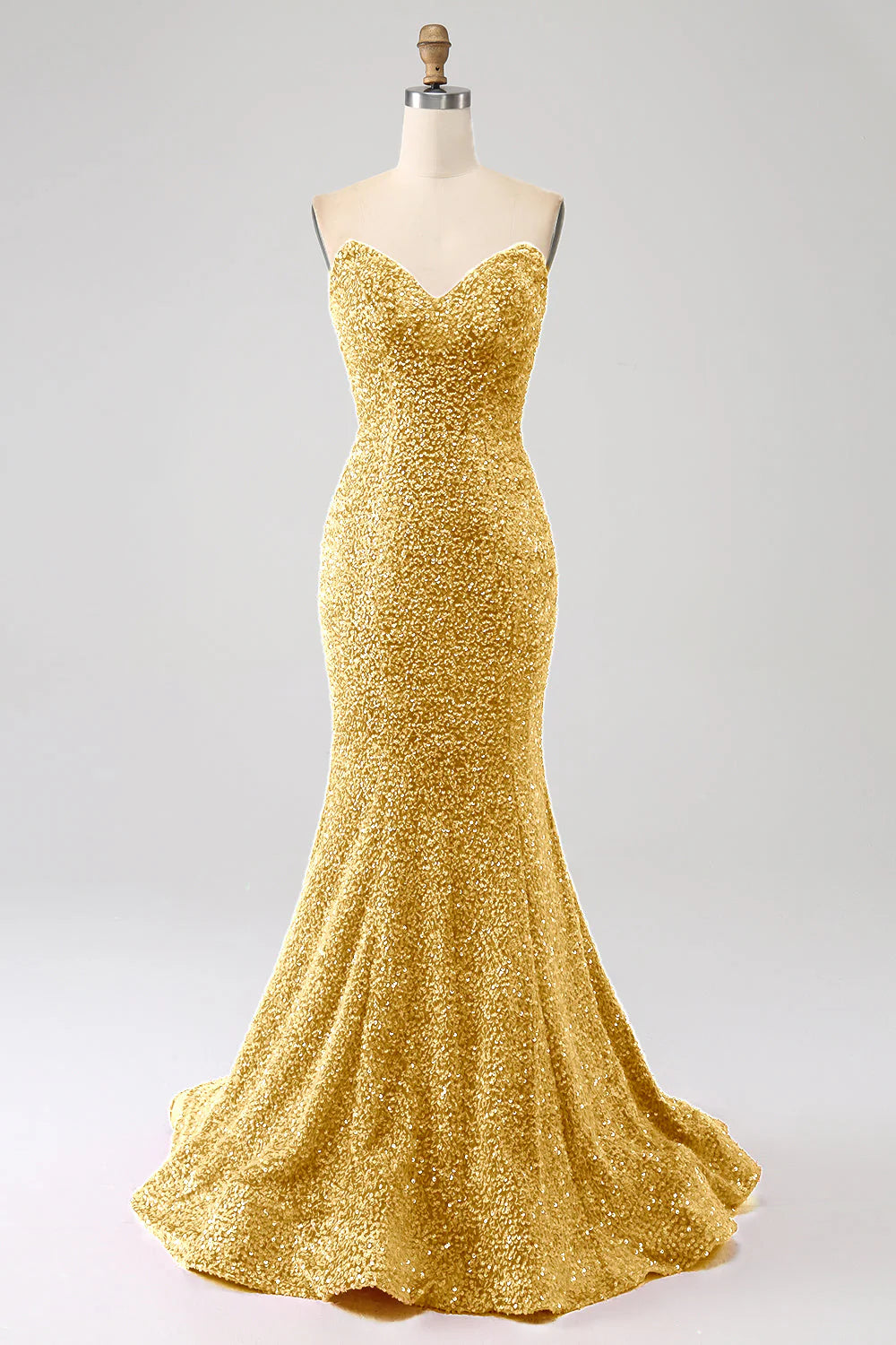 Elegant Golden mermaid prom dress with sweetheart neckline and sweep train.