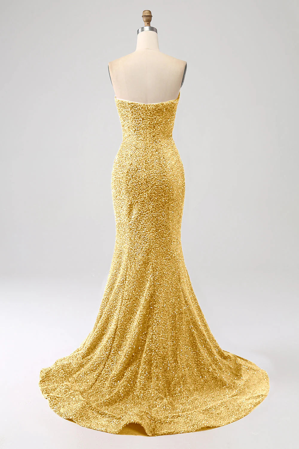 Back view of Golden mermaid prom dress showing sweep train.