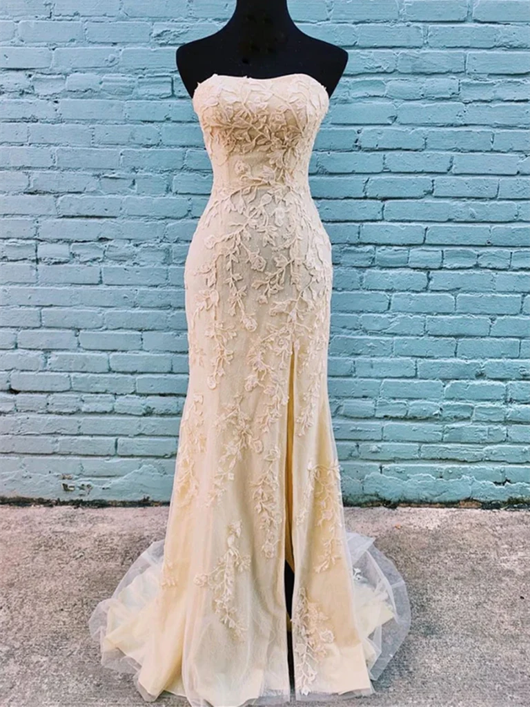 Woman wearing a long mermaid sweetheart tulle lace prom dress.