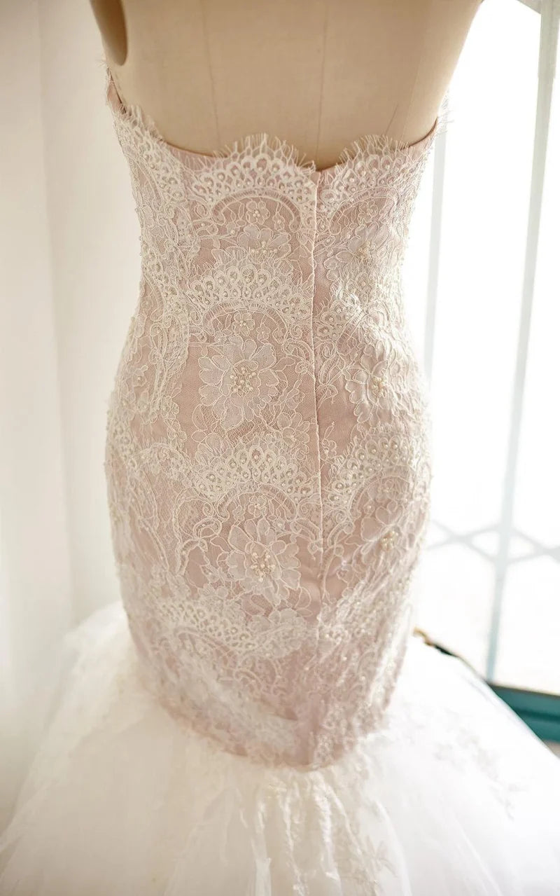 Side profile of a sweetheart neckline mermaid dress for formal events.