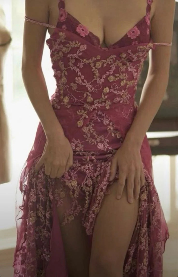 Elegant dusty rose mermaid prom dress with spaghetti straps and appliques on a model.