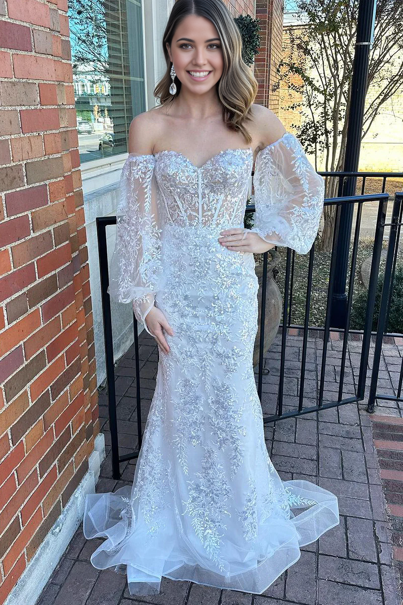 Elegant white lace mermaid prom dress with sweetheart neckline.